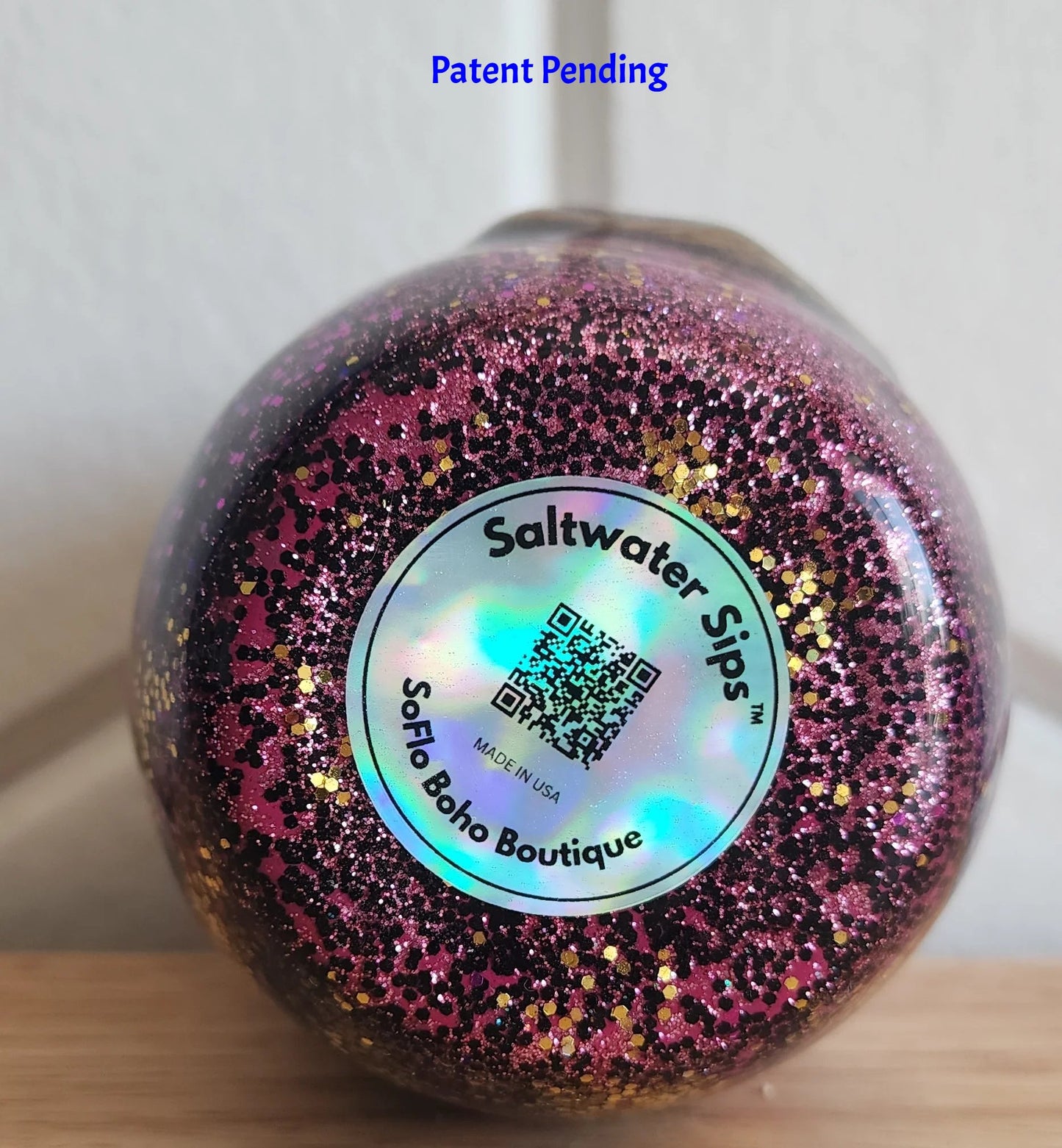 Saltwater Sips™ 12oz tumbler bottom view, holographic brand logo, Made in USA, Patent Pending