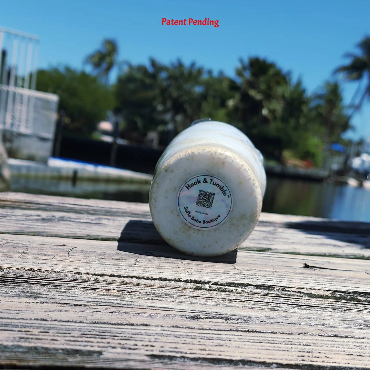 Base view of White Sands Hook & Tumble™ tumbler showing real fishing hooks and sand in clear epoxy resin