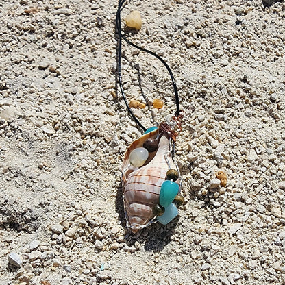 Handmade tulip shell pendant necklace with mixed metal wire wrap, turquoise beads, and wood accents on cord