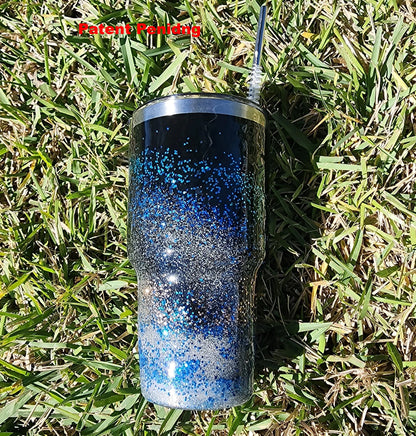 Saltwater Surge 30oz fishing hook tumbler with layered blue glitter and real sand epoxy design on beach