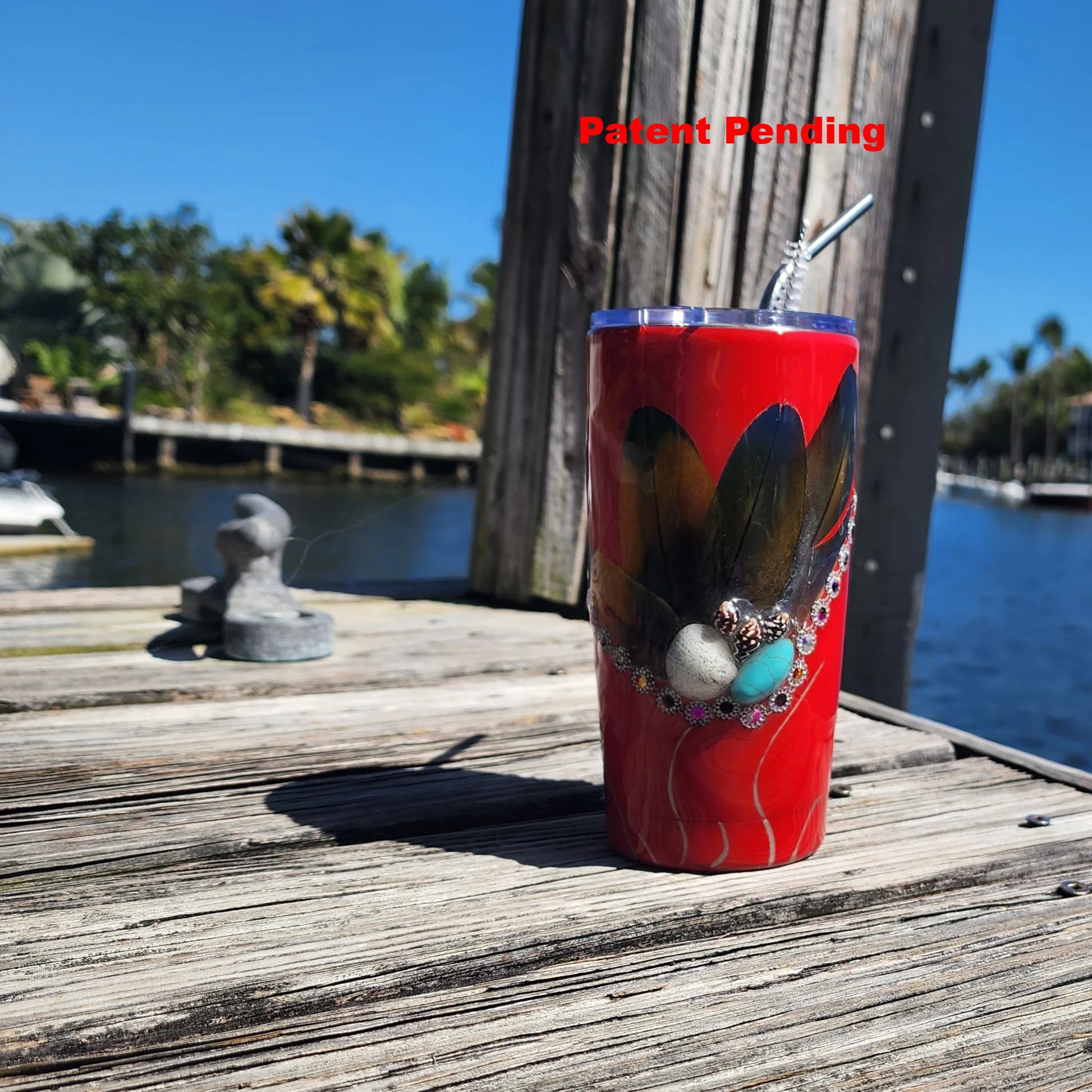 Red Saltwater Sips seashell tumbler on dock by water – coastal cowgirl cup 20oz
