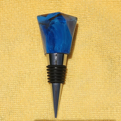 Geometric resin wine bottle stopper in sapphire blue, multiple angles