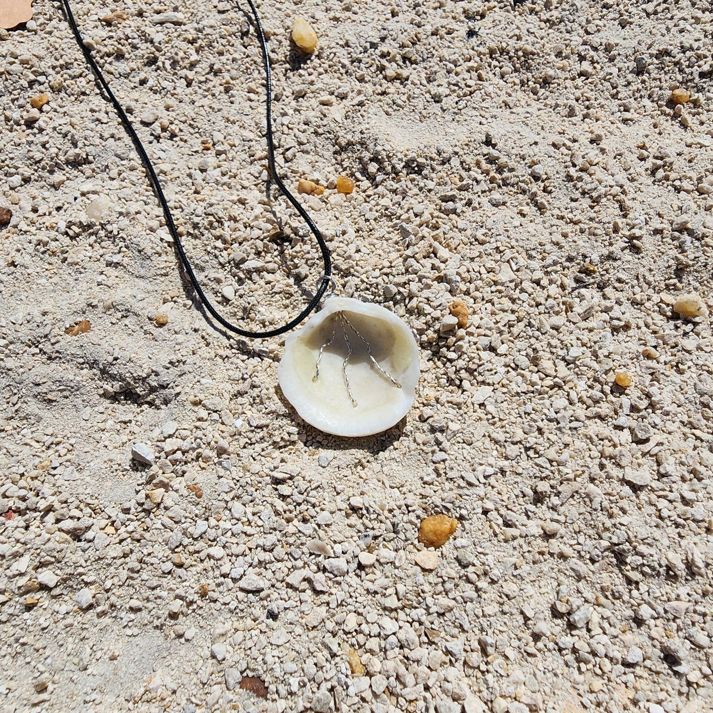 White Lucina shell pendant necklace with silver wire wrap and multicolor bead strands