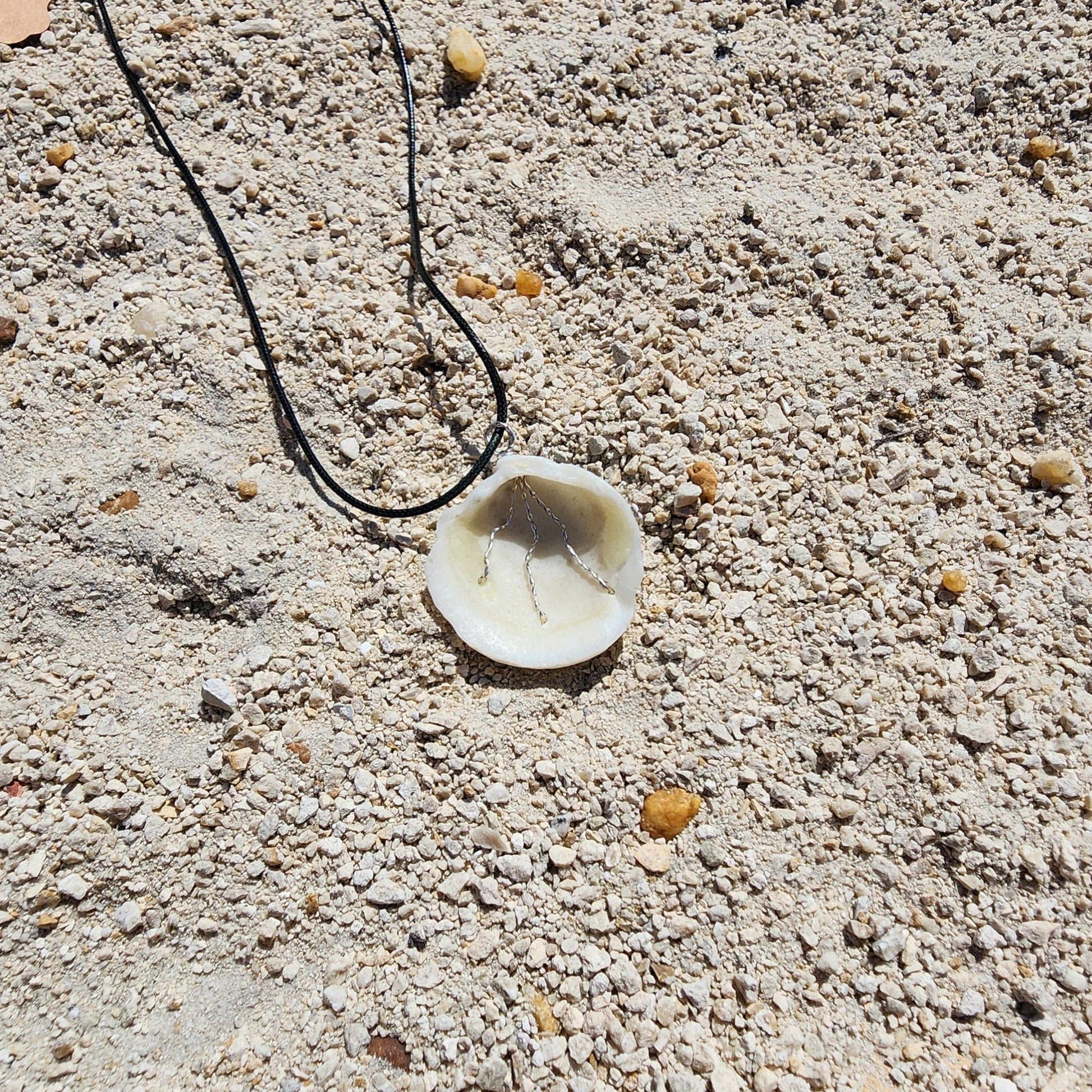 White Lucina shell pendant necklace with silver wire wrap and multicolor bead strands