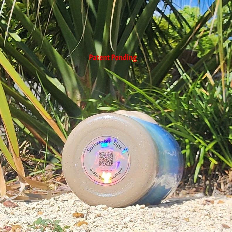 Saltwater Sips™ 20oz tumbler bottom view, holographic brand logo, Made in USA, Patent Pending