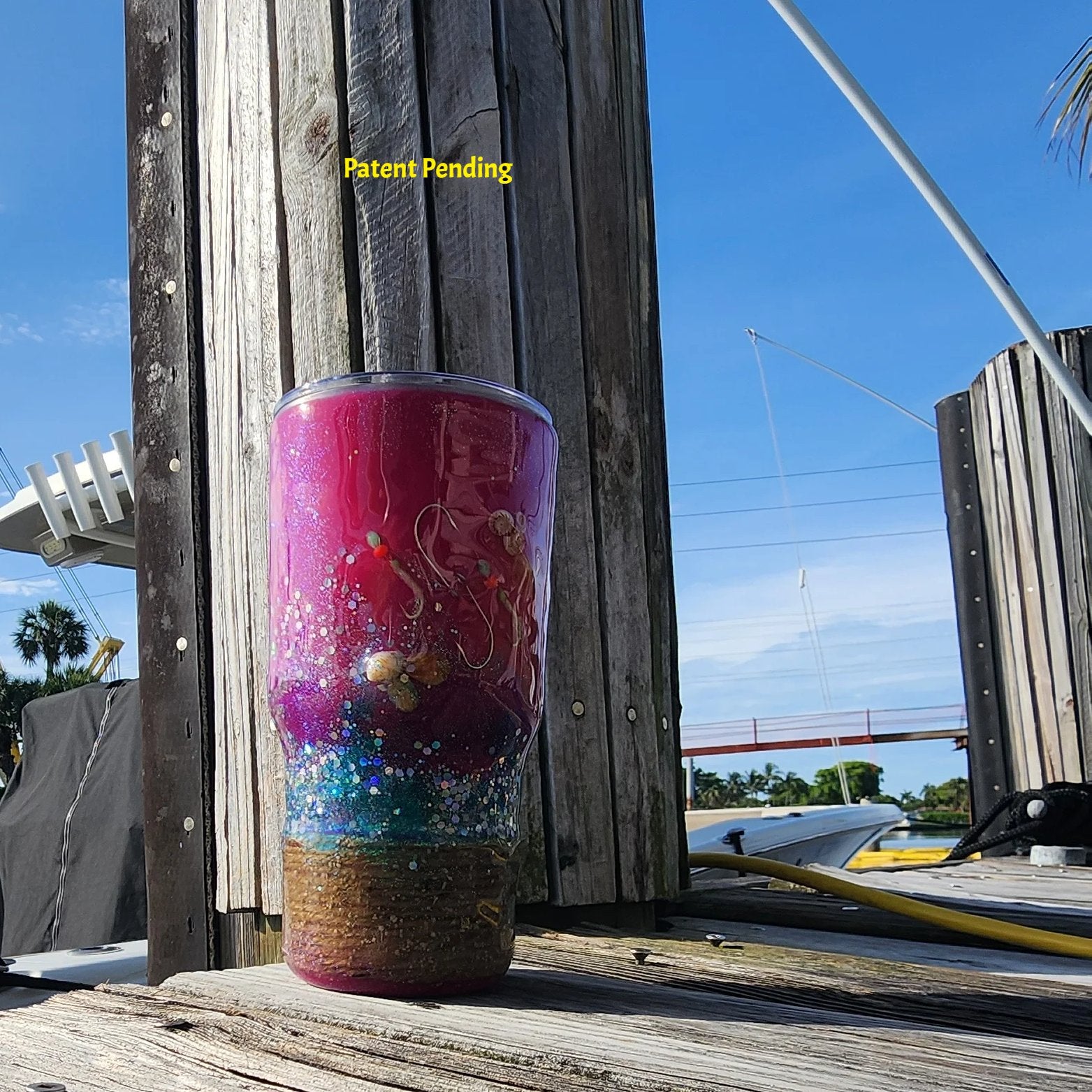 Hook & Tumble Magenta Tide tumbler showing snail shells and shrimp hooksHook & Tumble Magenta Tide tumbler showing snail shells and shrimp hooks
