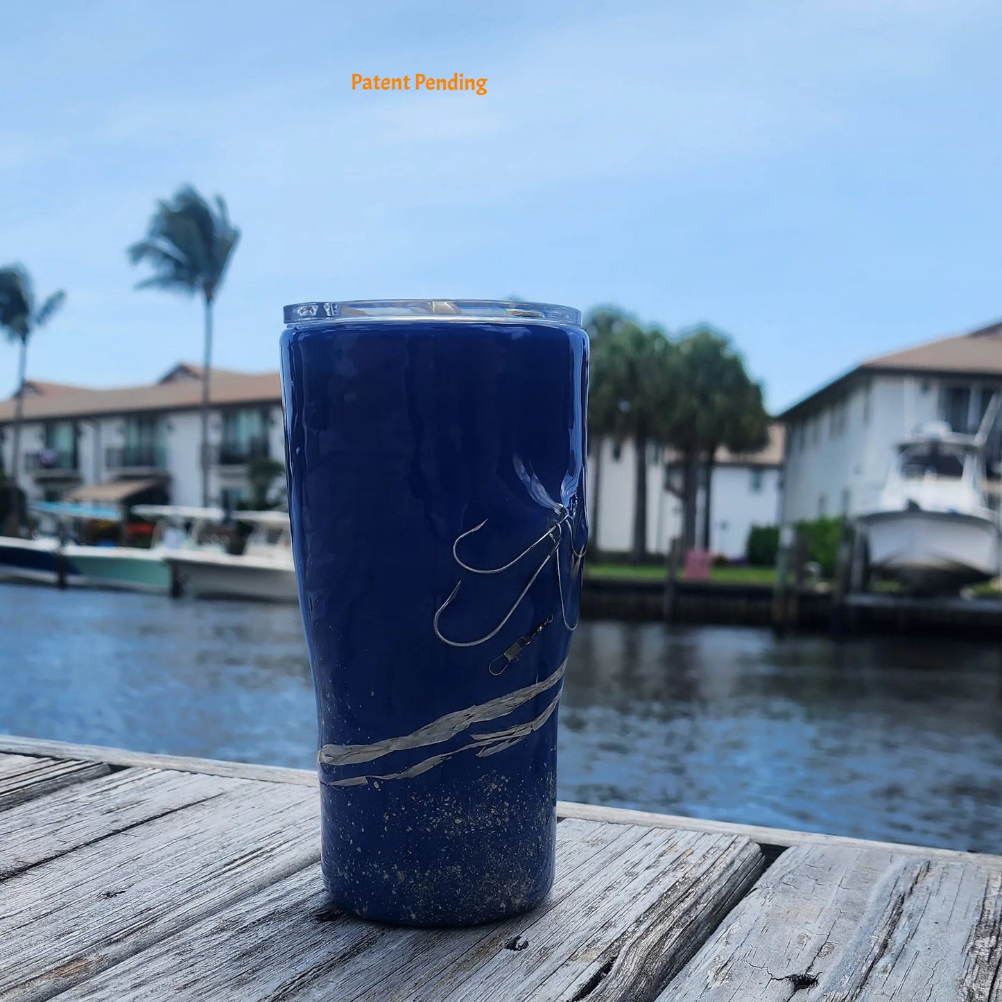 Handmade 20oz Blue Ink right side view fishing hook tumbler with real saltwater hooks, barrel swivel and natural raffia, Hook & Tumble coastal drinkware