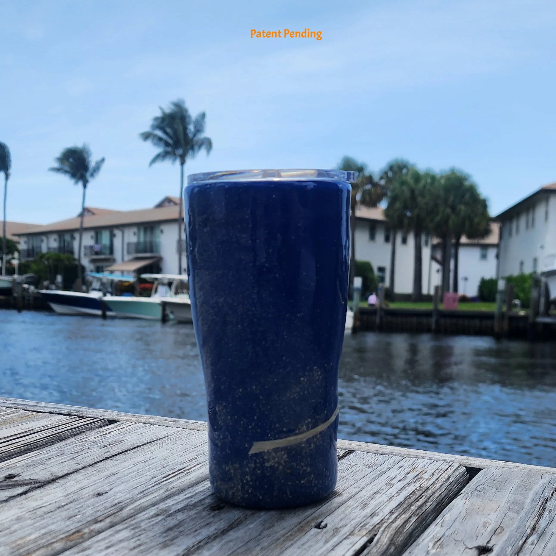 Handmade 20oz Blue Ink back side view fishing hook tumbler with real saltwater hooks, barrel swivel and natural raffia, Hook & Tumble coastal drinkware