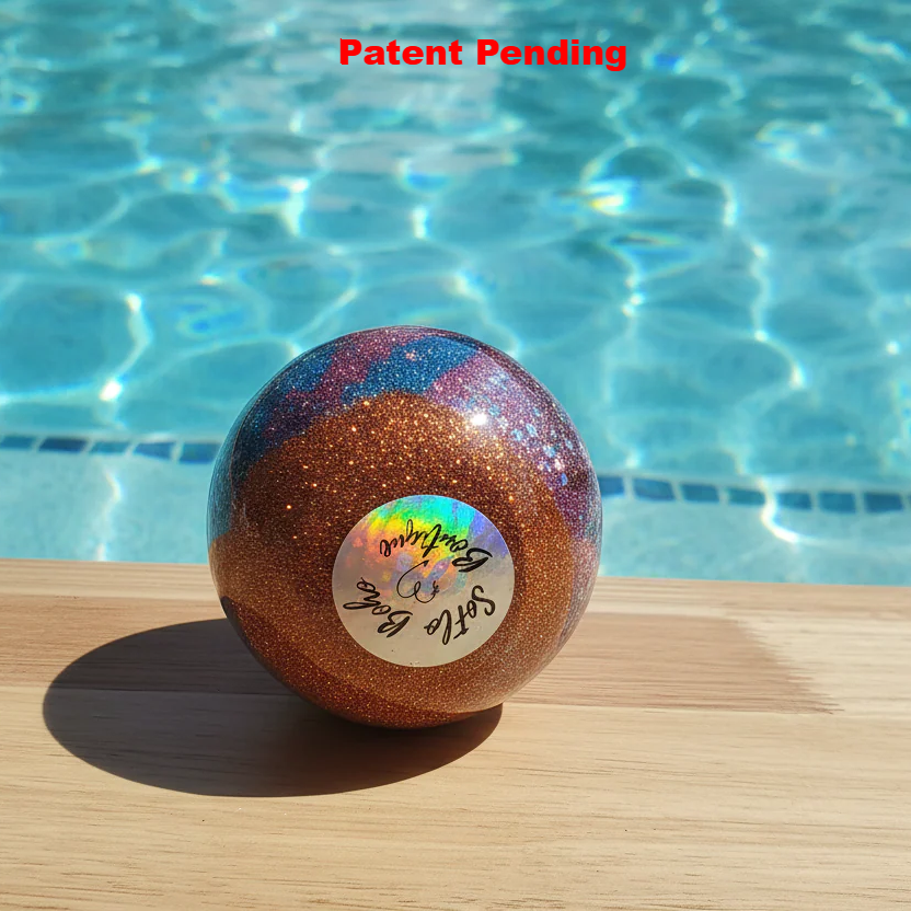 Burgundy and teal coastal wine glass by pool showing layered resin art and bronze glitter - Florida handmade