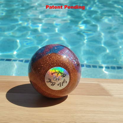 Burgundy and teal coastal wine glass by pool showing layered resin art and bronze glitter - Florida handmade