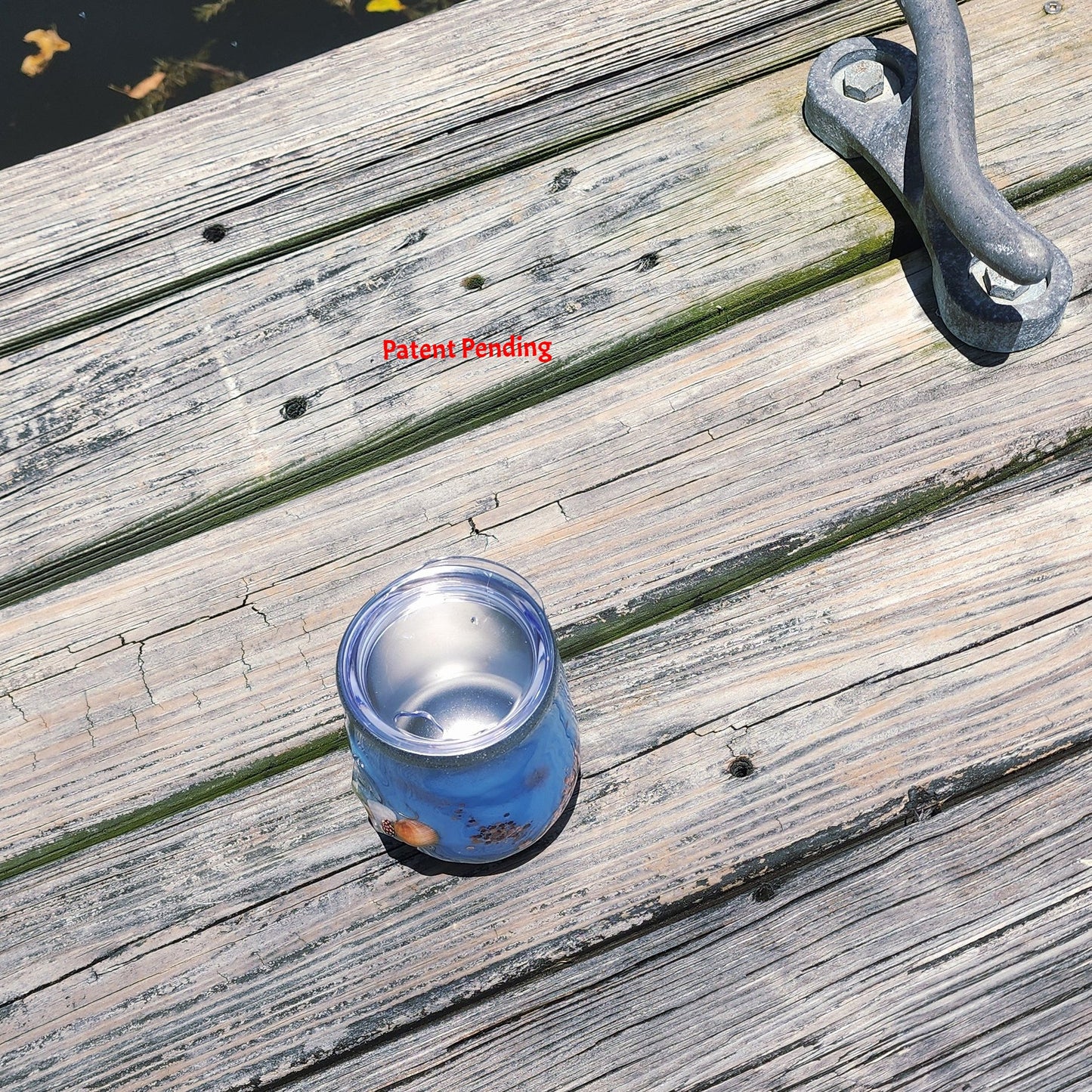 Top view of Rose Gold Saltwater Sips™ wine tumbler showing dense seashells, snail shell and rose gold glitter in clear epoxy resin