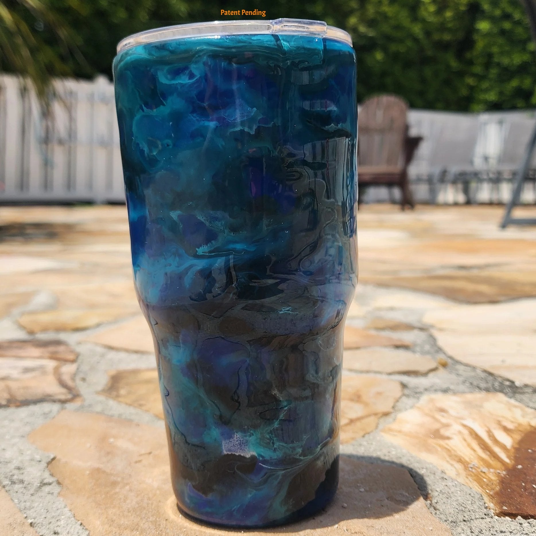 Close up Blue Open Water fishing hook tumbler showing deep cobalt and teal handmade 30oz coastal drinkware