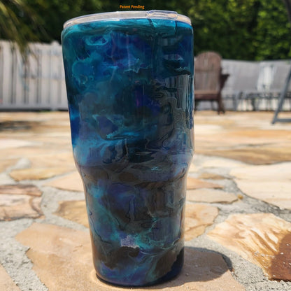 Close up Blue Open Water fishing hook tumbler showing deep cobalt and teal handmade 30oz coastal drinkware