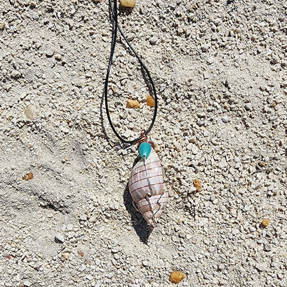 Handmade tulip shell pendant necklace with mixed metal wire wrap, turquoise beads, and wood accents on cord