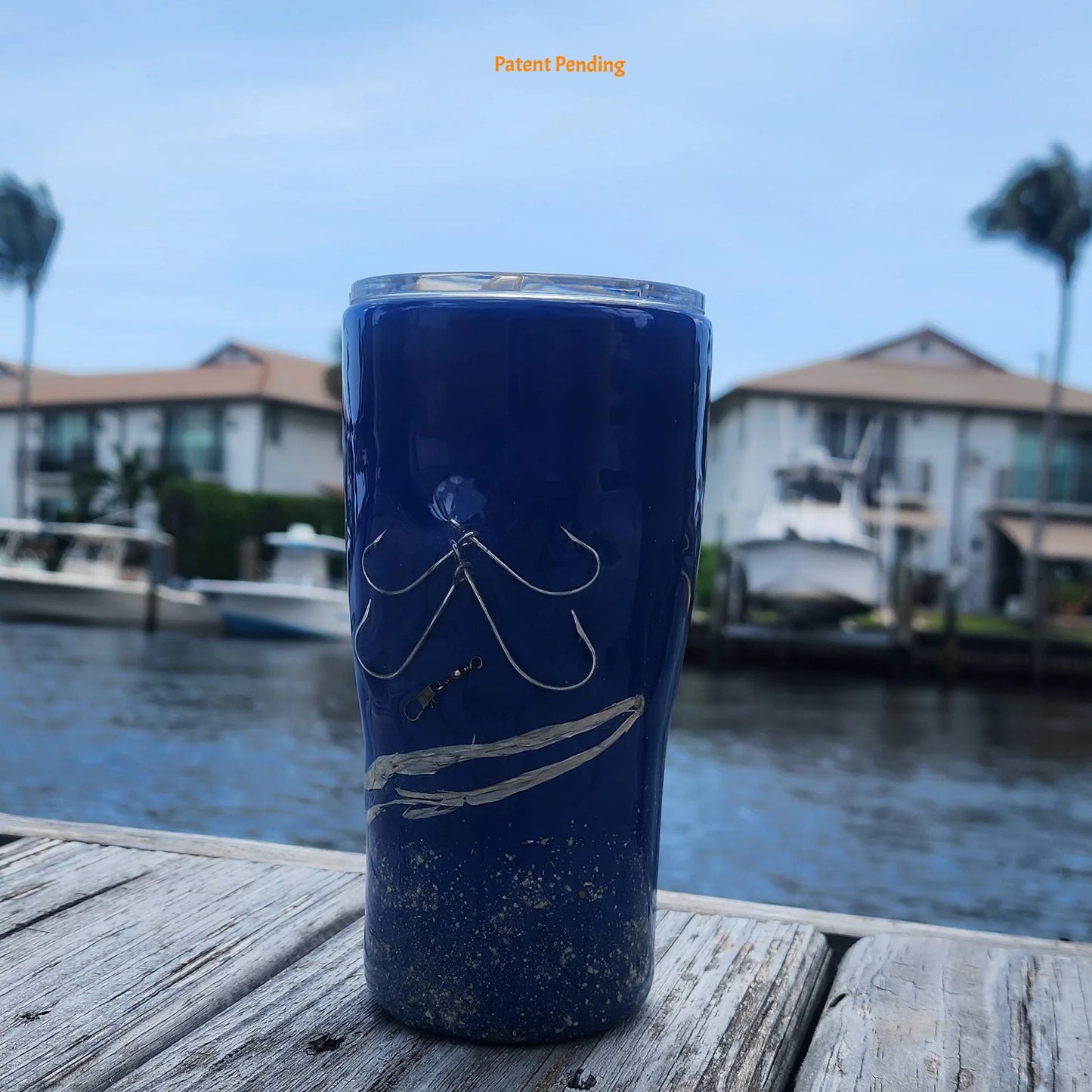 Handmade 20oz Blue Ink close up of fishing hook tumbler with real saltwater hooks, barrel swivel and natural raffia, Hook & Tumble coastal drinkware