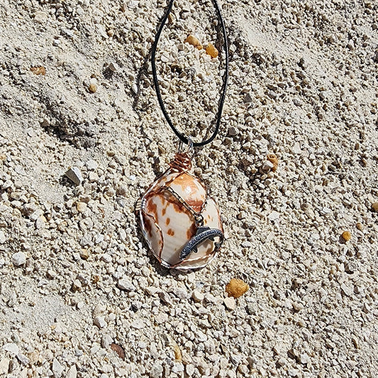 Seashell pendant necklace with fish charm and wire wrap on cord