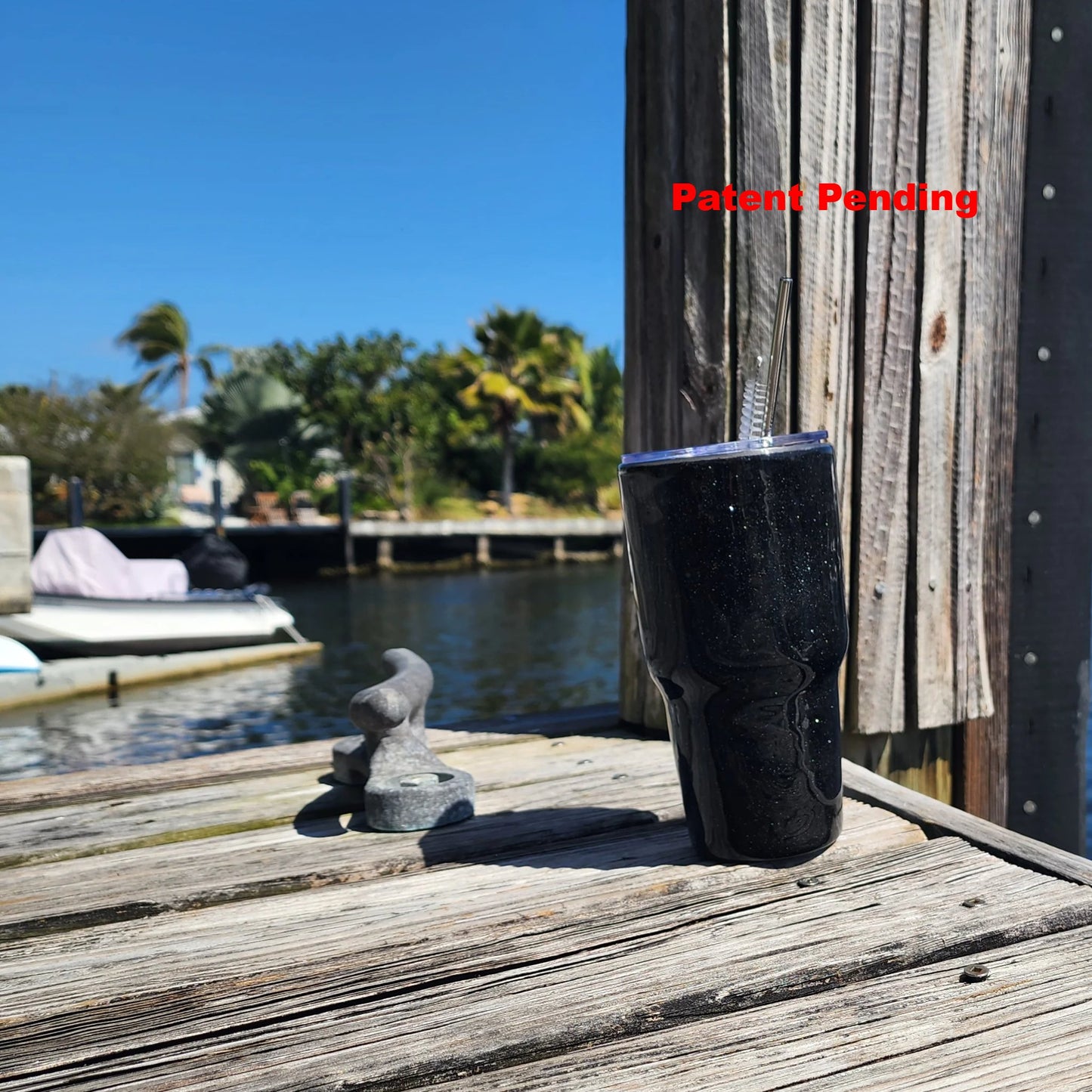 Black Saltwater Sips 30oz tumbler on dock by water – insulated coastal cowgirl drinkware