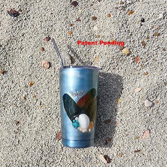 Teal insulated tumbler on beach sand with ocean-inspired shimmer finish