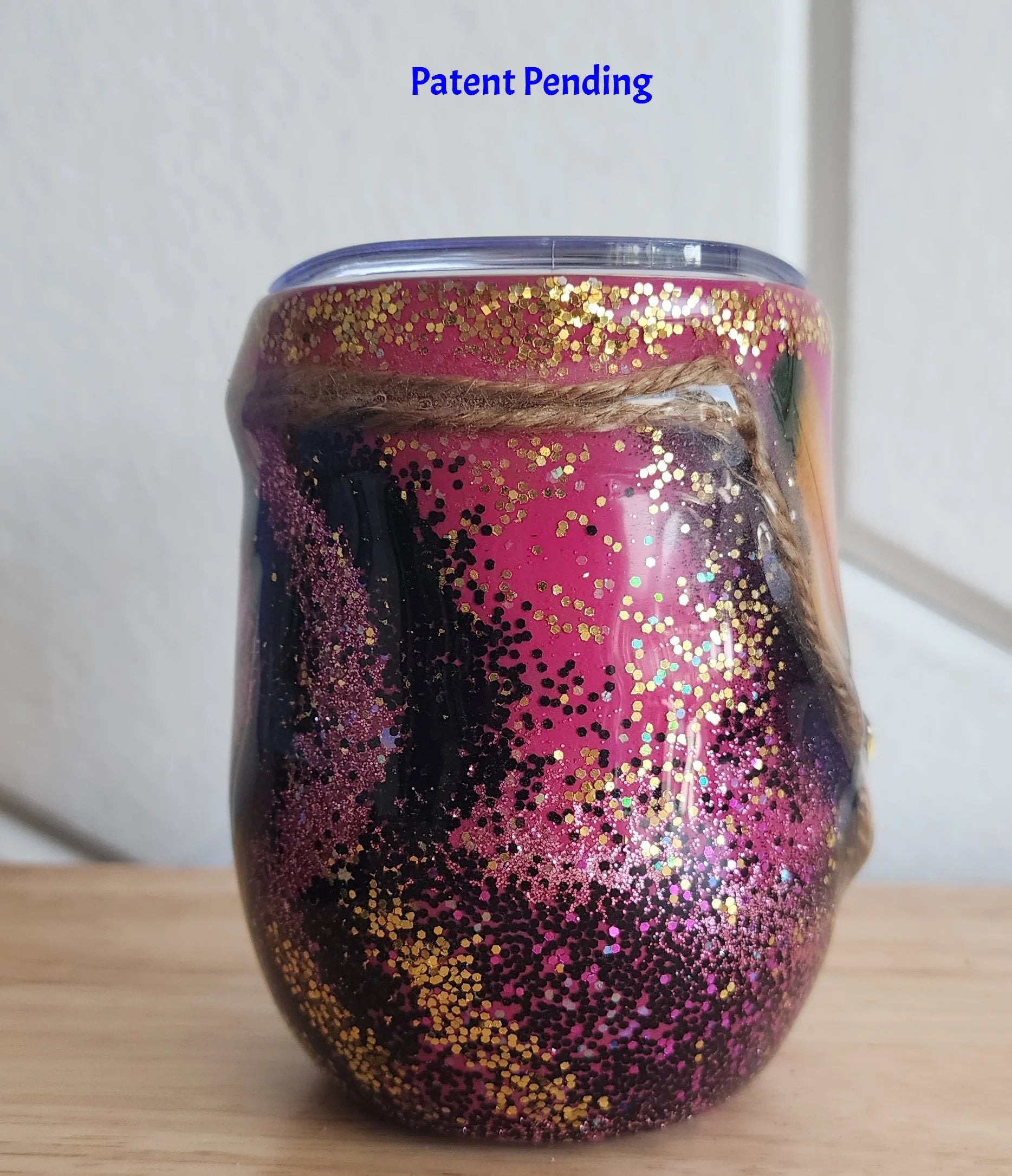Magenta boho Saltwater Sips™ 12oz wine tumbler left side, natural twine wrap gold glitter crown, Patent Pending