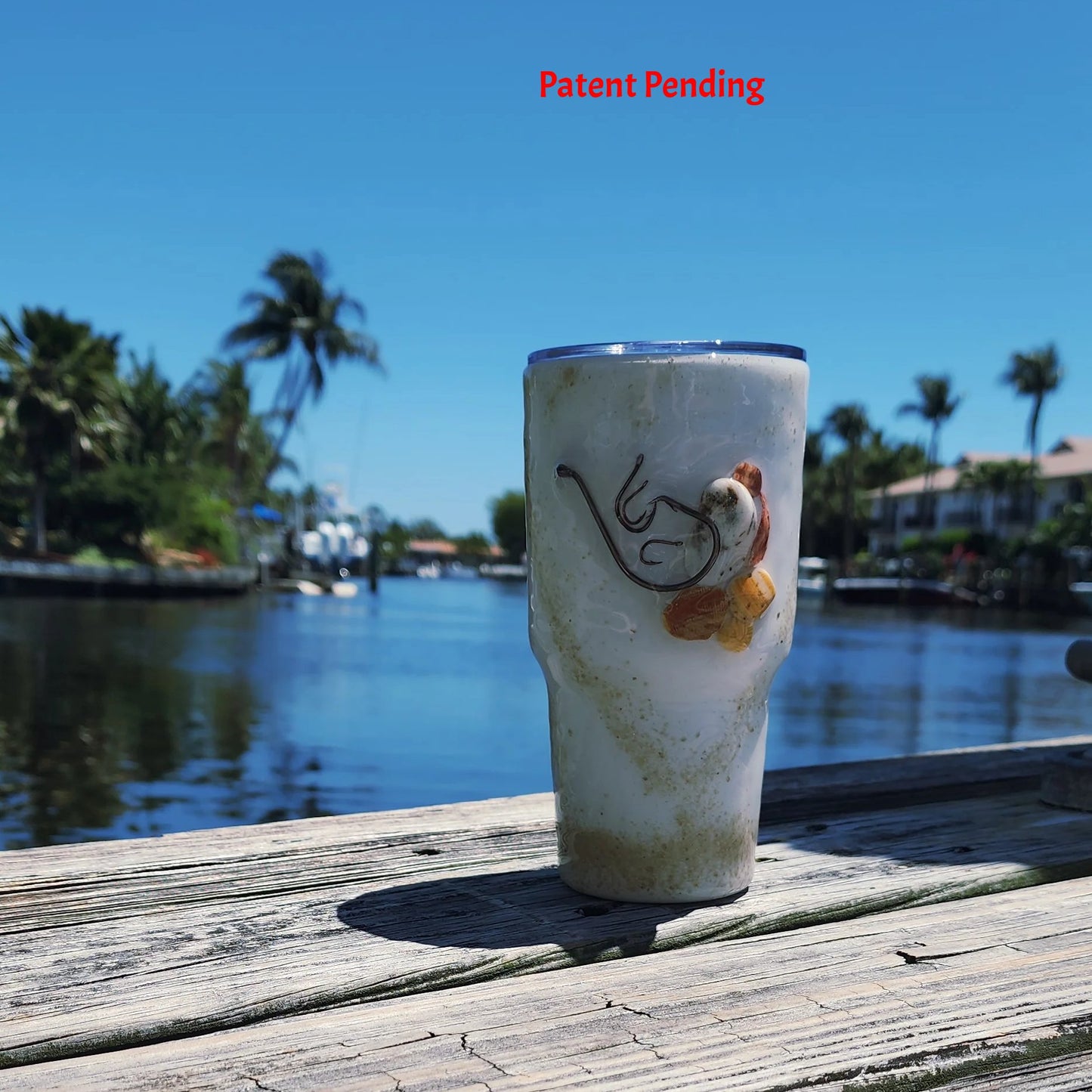 Side angle Shore Thing Hook & Tumble™ showing multiple real fishing hooks and seashell pieces in epoxy resin