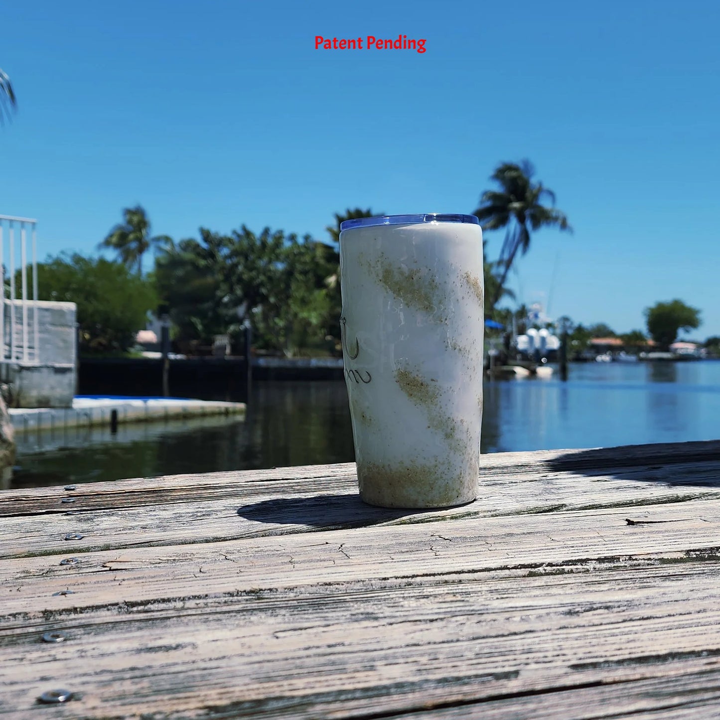 Left side view White Sands Hook & Tumble™ 20oz coastal epoxy resin tumbler outdoors