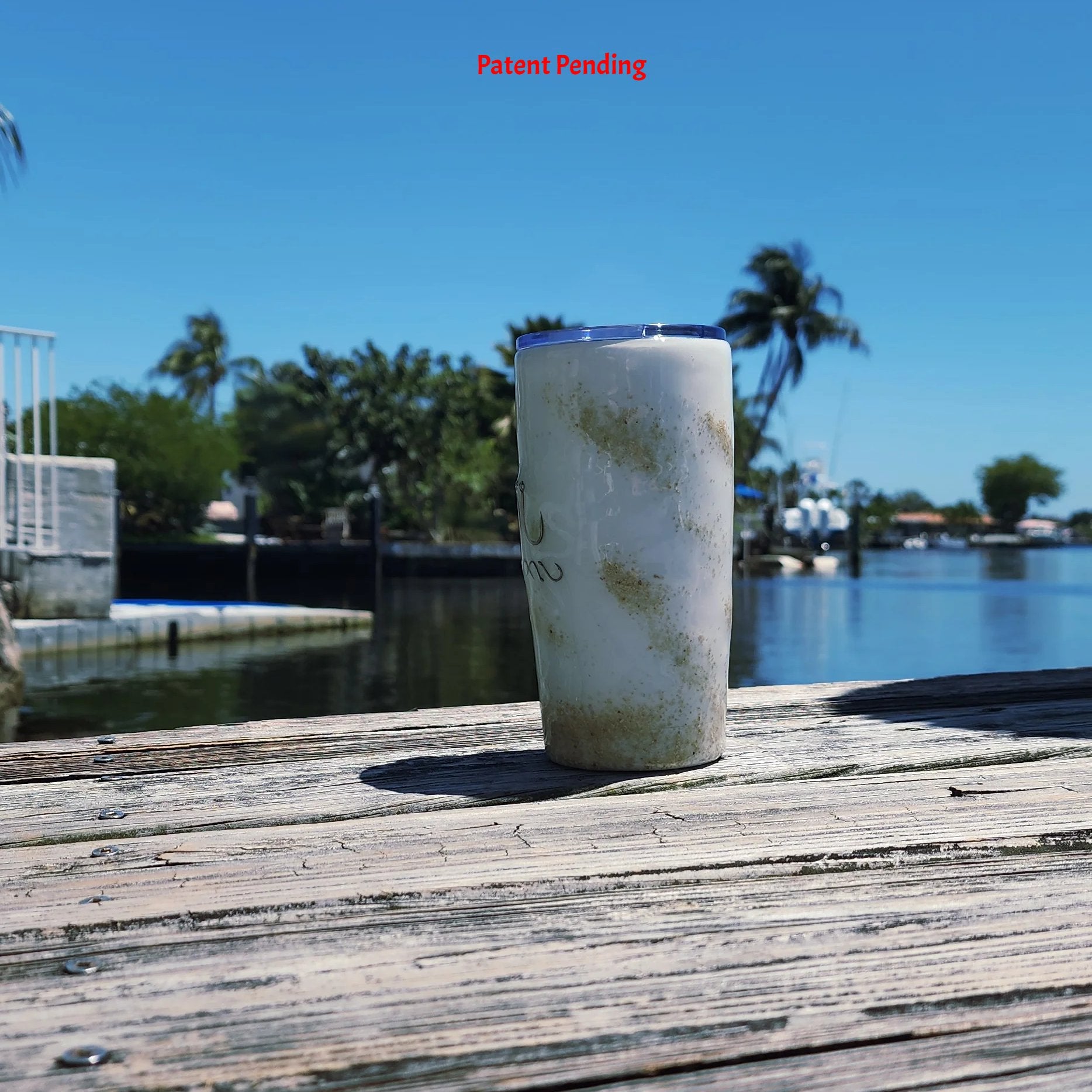 Left side view White Sands Hook & Tumble™ 20oz coastal epoxy resin tumbler outdoors