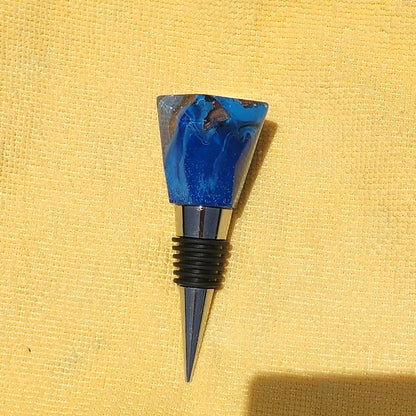 Geometric resin wine bottle stopper in sapphire blue, multiple angles