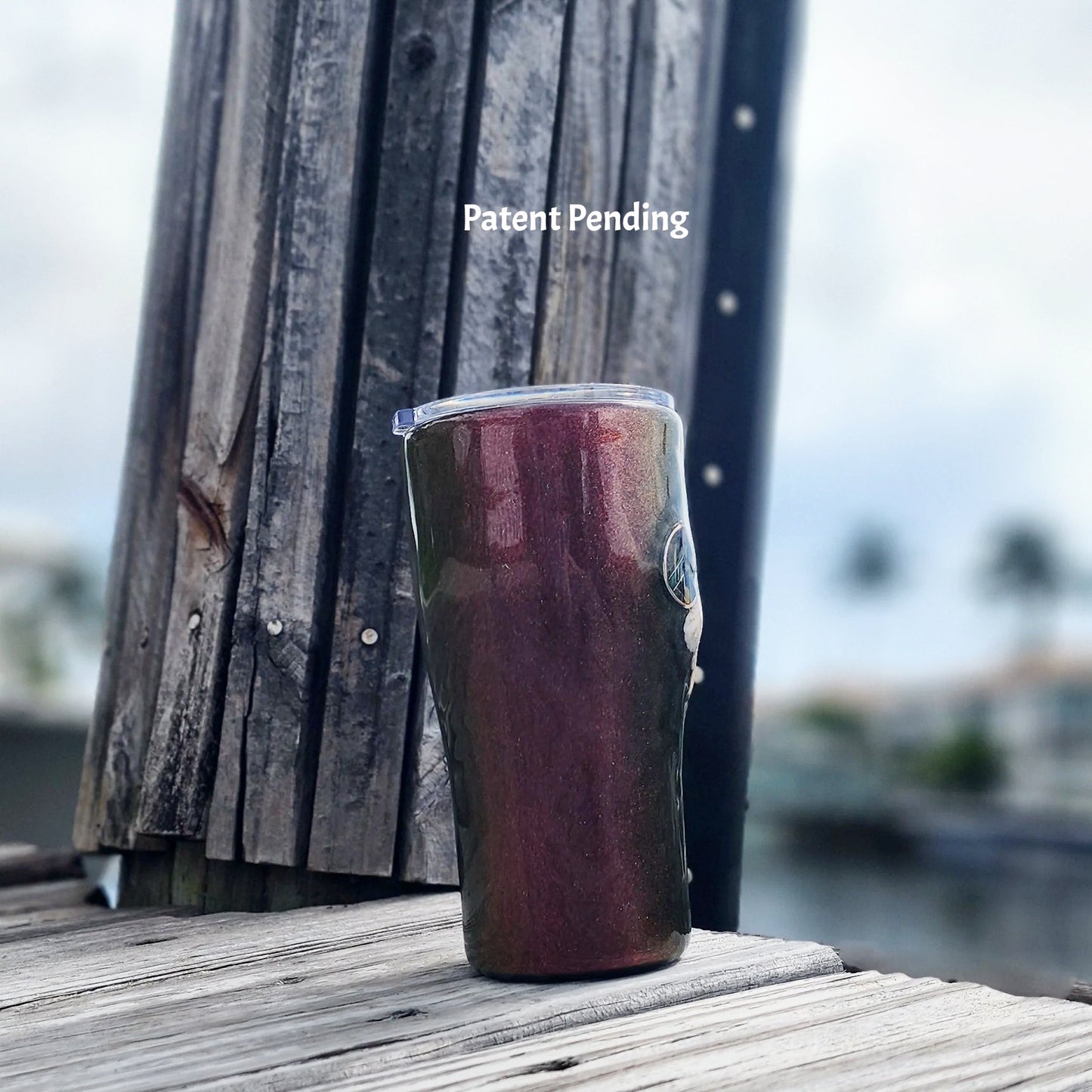 Right view of seashell tumbler with peace sign charm, colorshift finish, handmade in Florida