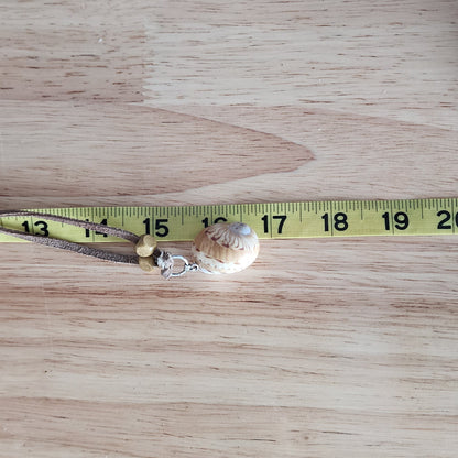 Adjustable choker necklace shown with measuring tape,