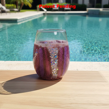 Handmade coastal wine glass with teal seaweed forms and burgundy glitter in natural sunlight - 18oz stemless