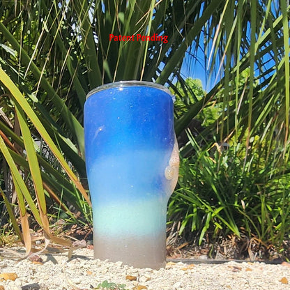 Blue ombre Saltwater Sips™ 20oz seashell tumbler left side, sandy shimmer base, Patent Pending, handcrafted in South Florida