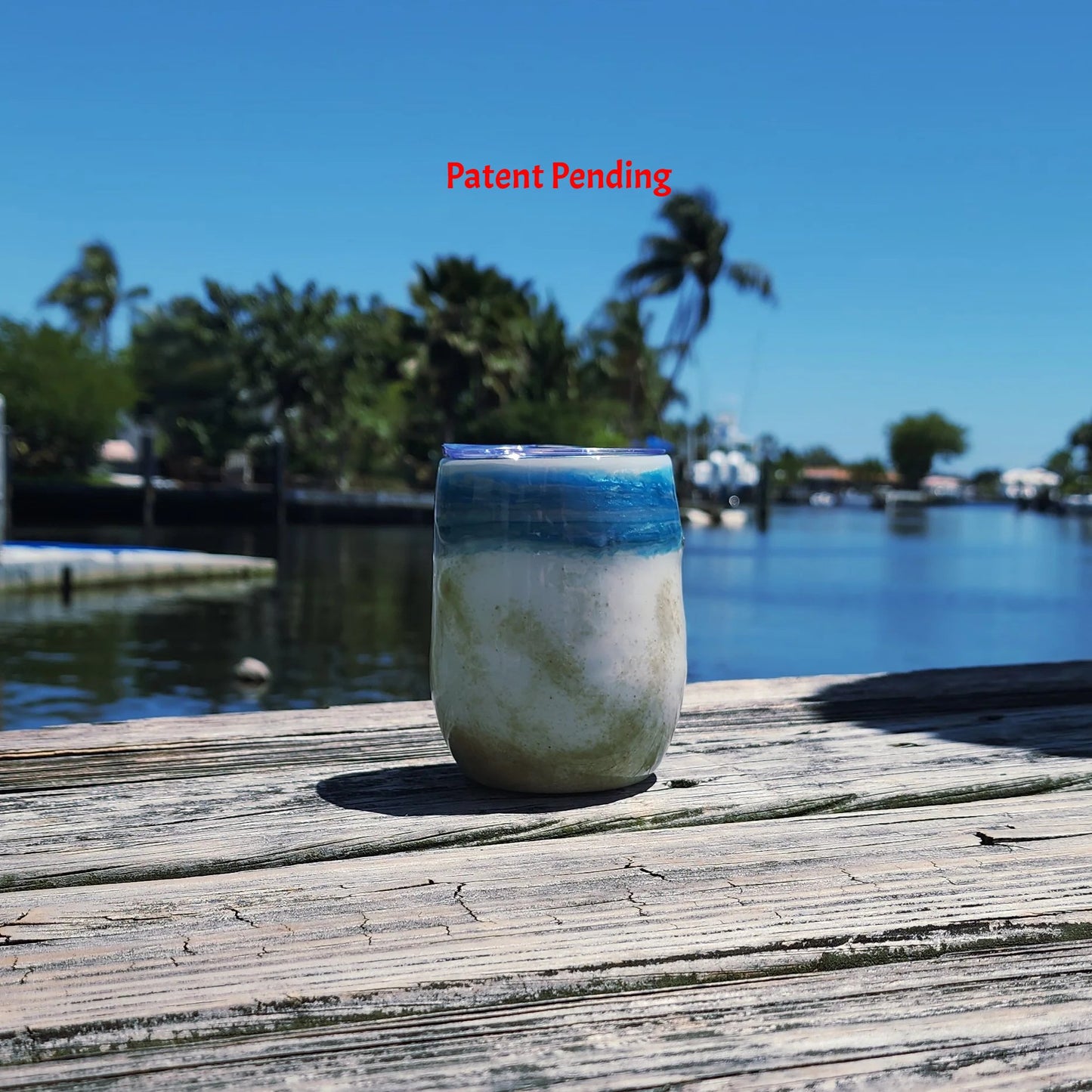Ocean Fade Hook & Tumble™ 12oz wine tumbler on dock – hand-painted blue to white fade with real fishing hooks and sand handmade South Florida