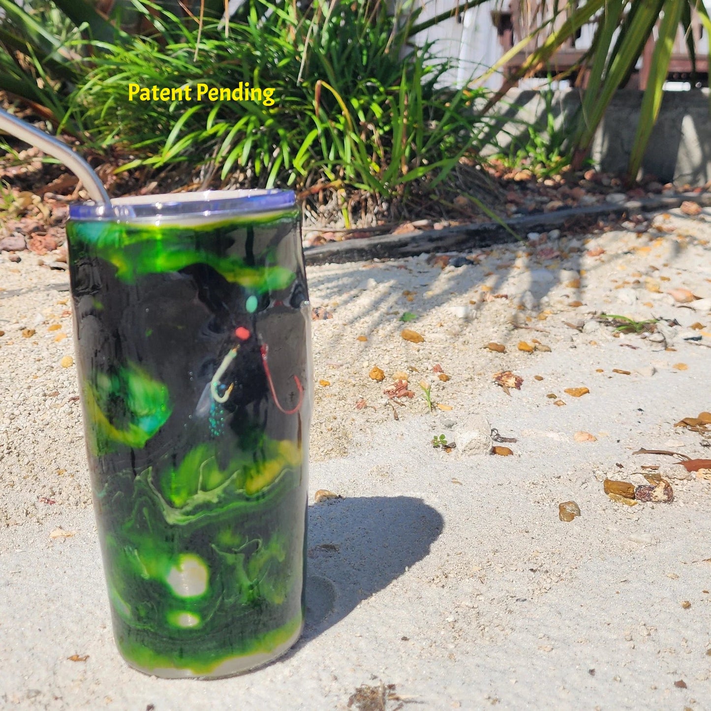 Night Tide Green fishing hook tumbler 20oz on sand, Patent Pending Hook & Tumble handmade coastal drinkware
