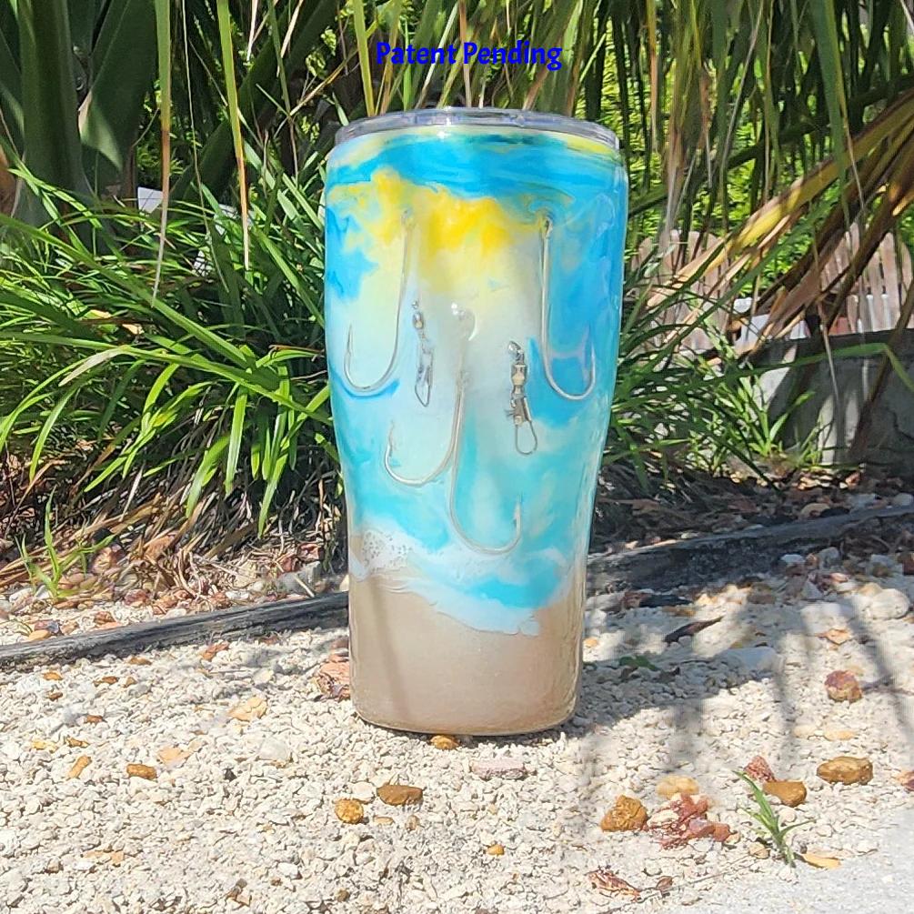 Turquoise ocean wave fishing hook tumbler 20oz front view, real metal hooks and barrel swivels, sandy shimmer base, Hook & Tumble™ Patent Pending