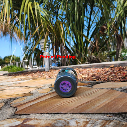 Ocean-shimmer teal finish on handmade USA seashell tumbler