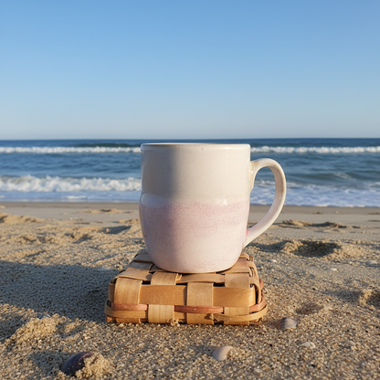 Handmade seashell coffee mug side view showing handle and glitter