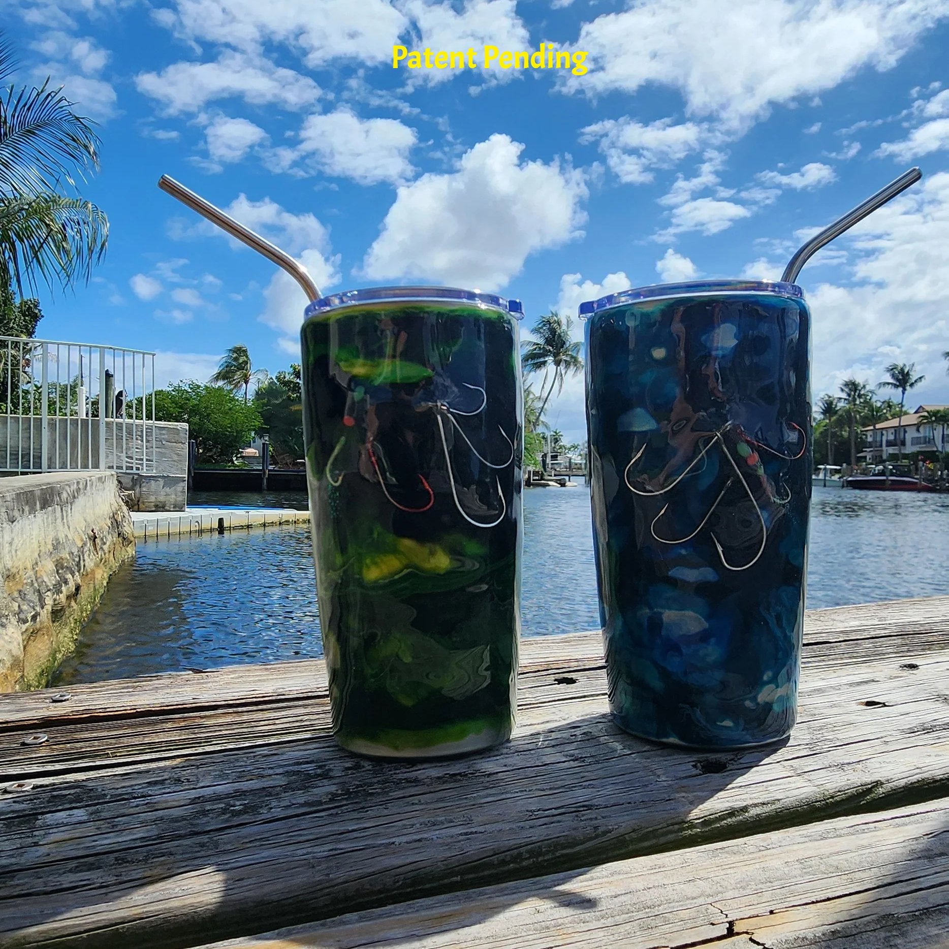 Night Tide Green and Blue Lagoon 20oz Hook & Tumble fishing hook tumblers on wooden dock, deep green tones and deep blue tones
