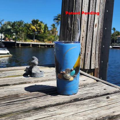 Blue Saltwater Sips seashell tumbler on dock by water – handmade coastal cowgirl drinkware 20oz