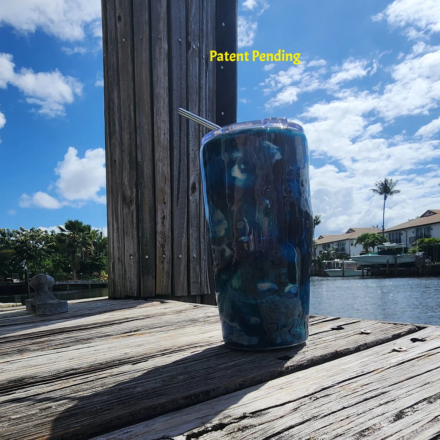 Hook & Tumble Blue Lagoon coastal tumbler on dock with blue sky, handmade fishing drinkware USA