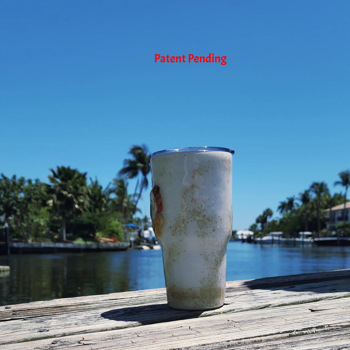 Left side view Shore Thing Hook & Tumble™ handmade tumbler on weathered dock South Florida