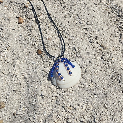 White Lucina shell pendant necklace with silver wire wrap and purple bead strands
