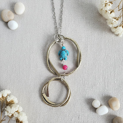 Boho brass pendant necklace with howlite turtle bead and red glass accent