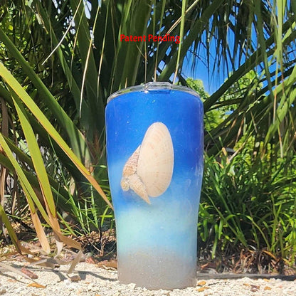 Blue ombre Saltwater Sips™ 20oz seashell tumbler front view, real Florida seashell centered, cobalt blue to sandy ombre, Patent Pending