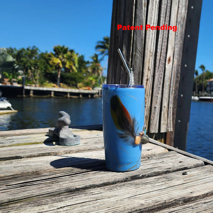 Blue Saltwater Sips seashell tumbler on dock by water – handmade coastal cowgirl drinkware 20oz