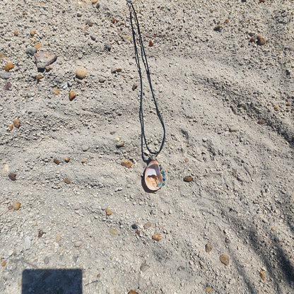 Handmade common atlantic seashell pendant necklace backside with silver wire wrap and blue green beads