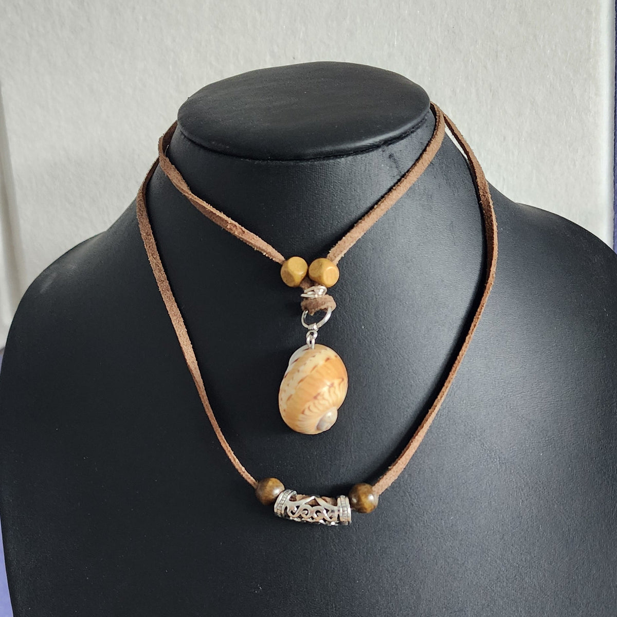 Colorful Moon Snail Shell adjustable choker necklace on brown faux suede cord