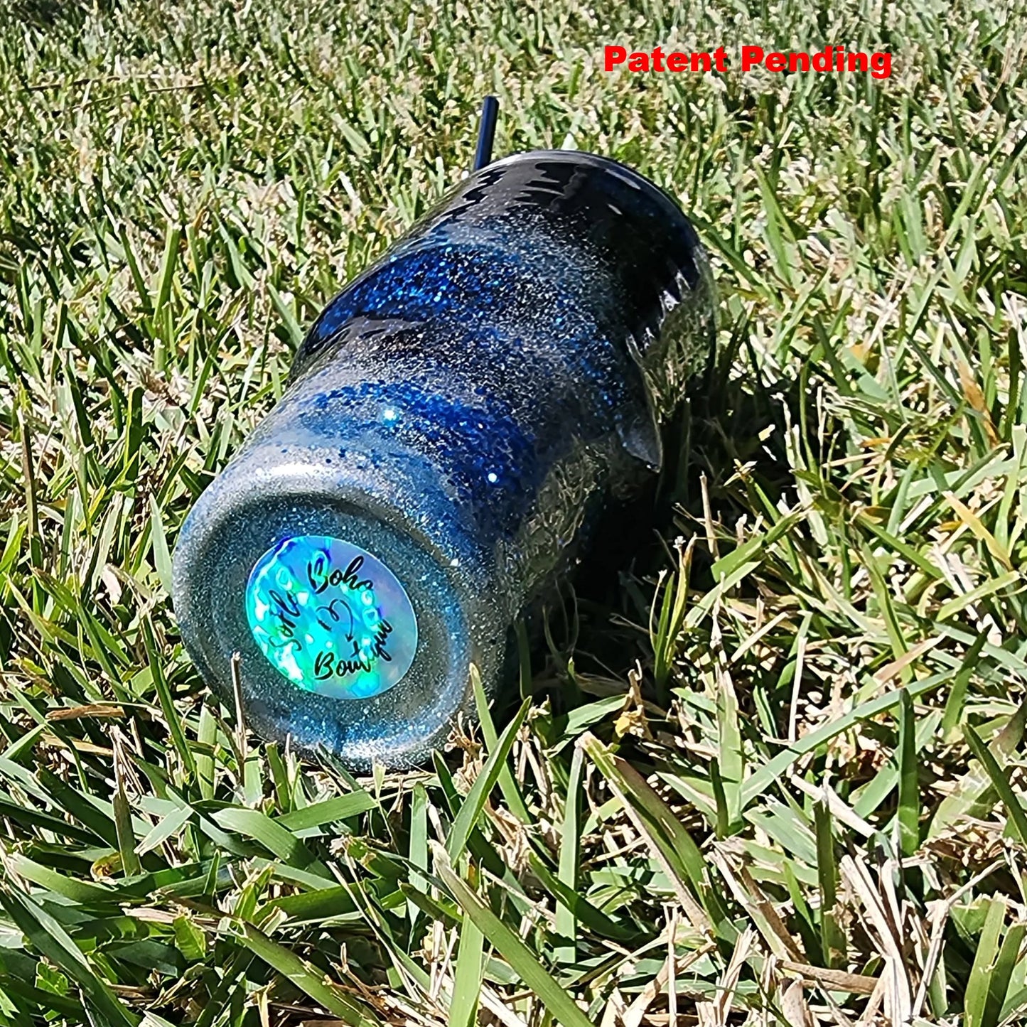 Saltwater Surge 30oz fishing hook tumbler with layered blue glitter and real sand epoxy design on beach