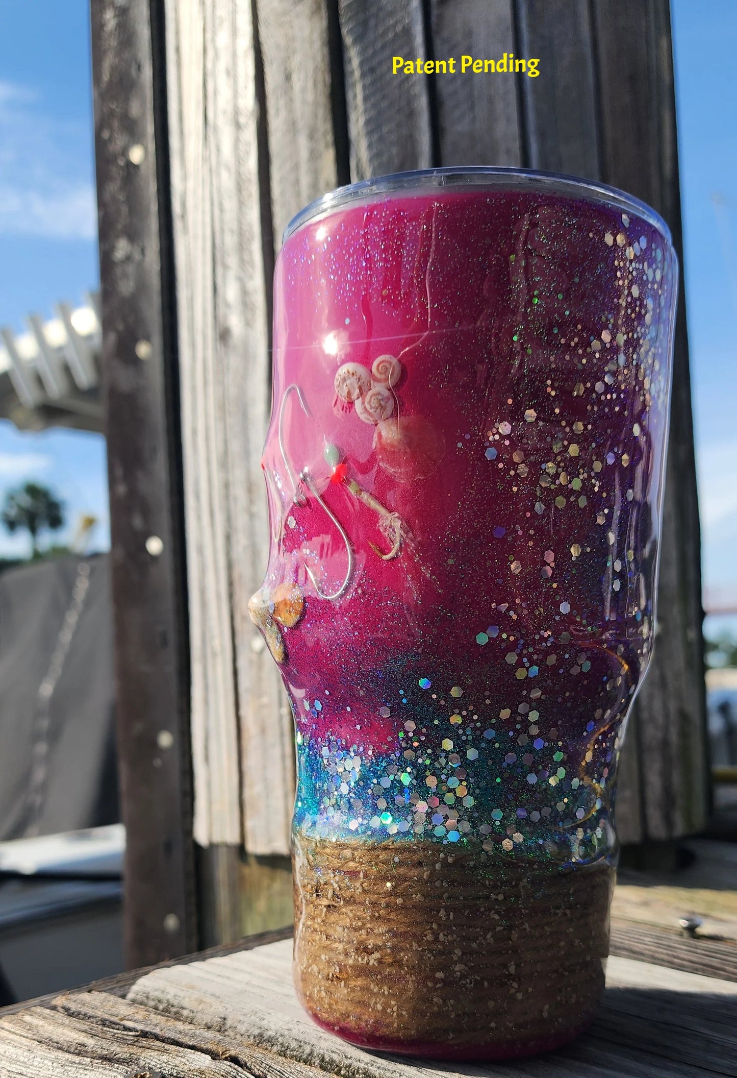 Side view of 30os magenta fish hook tumbler