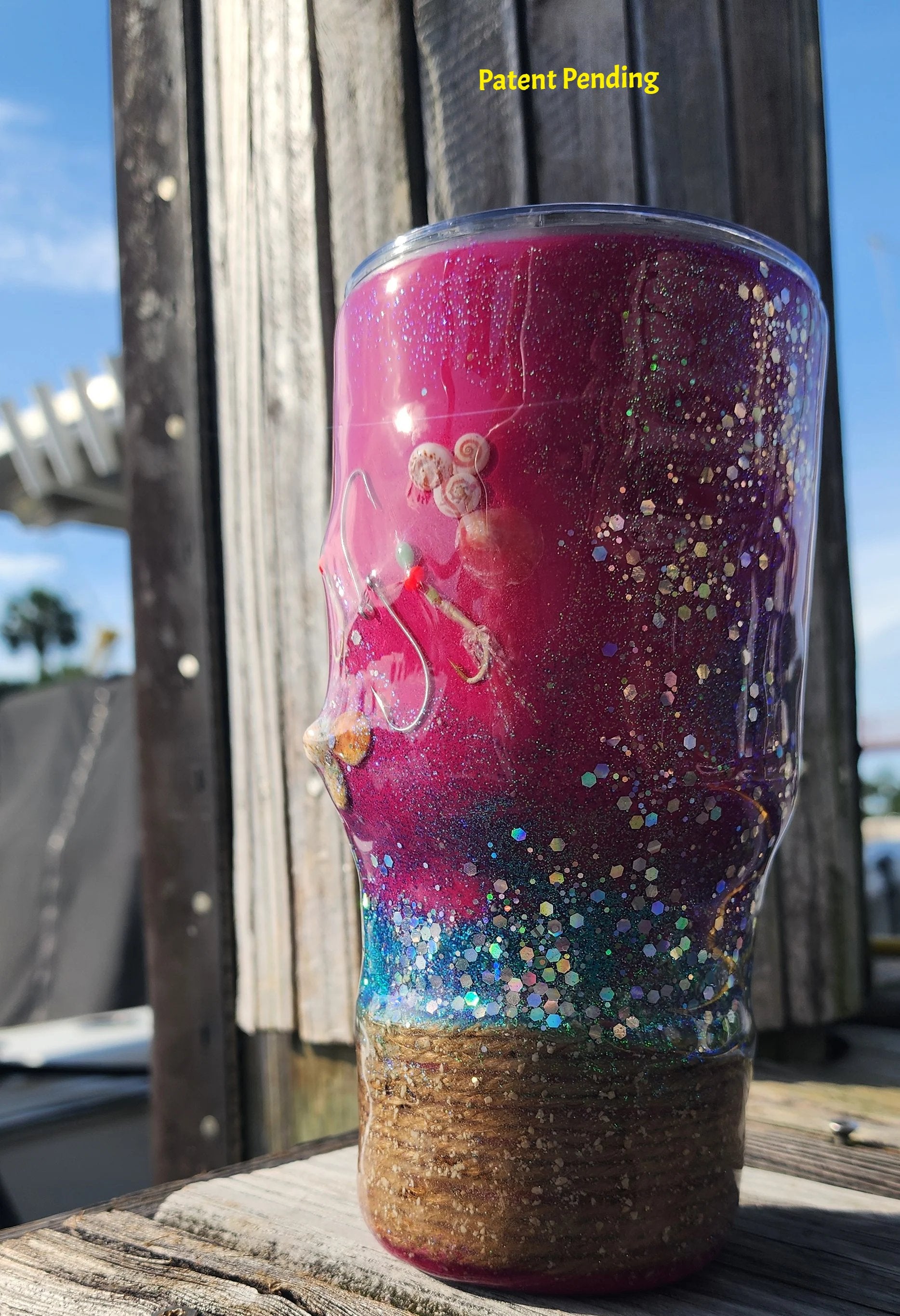 Side view of 30os magenta fish hook tumbler