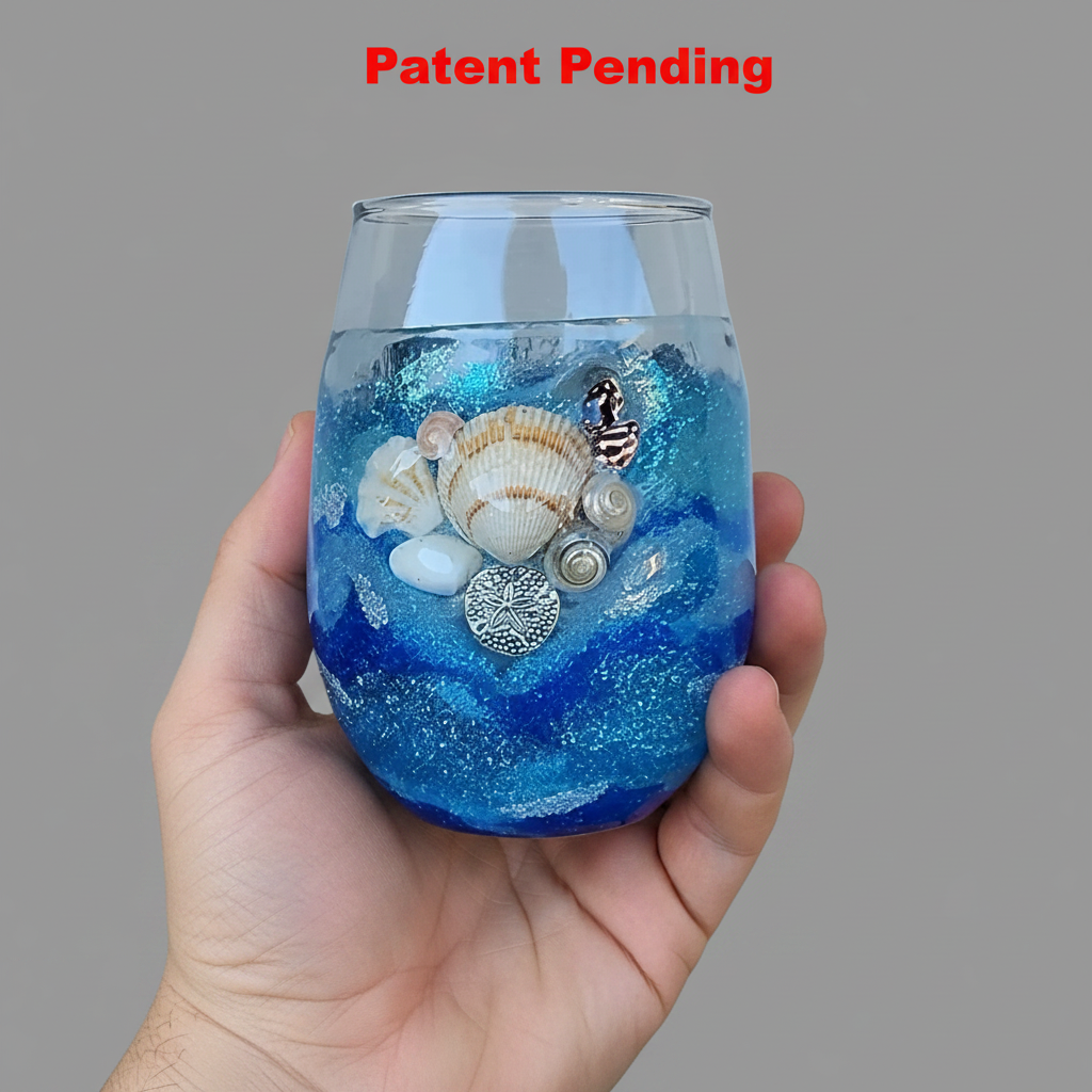 blue seashell stemless wine glass held in hand with grey background